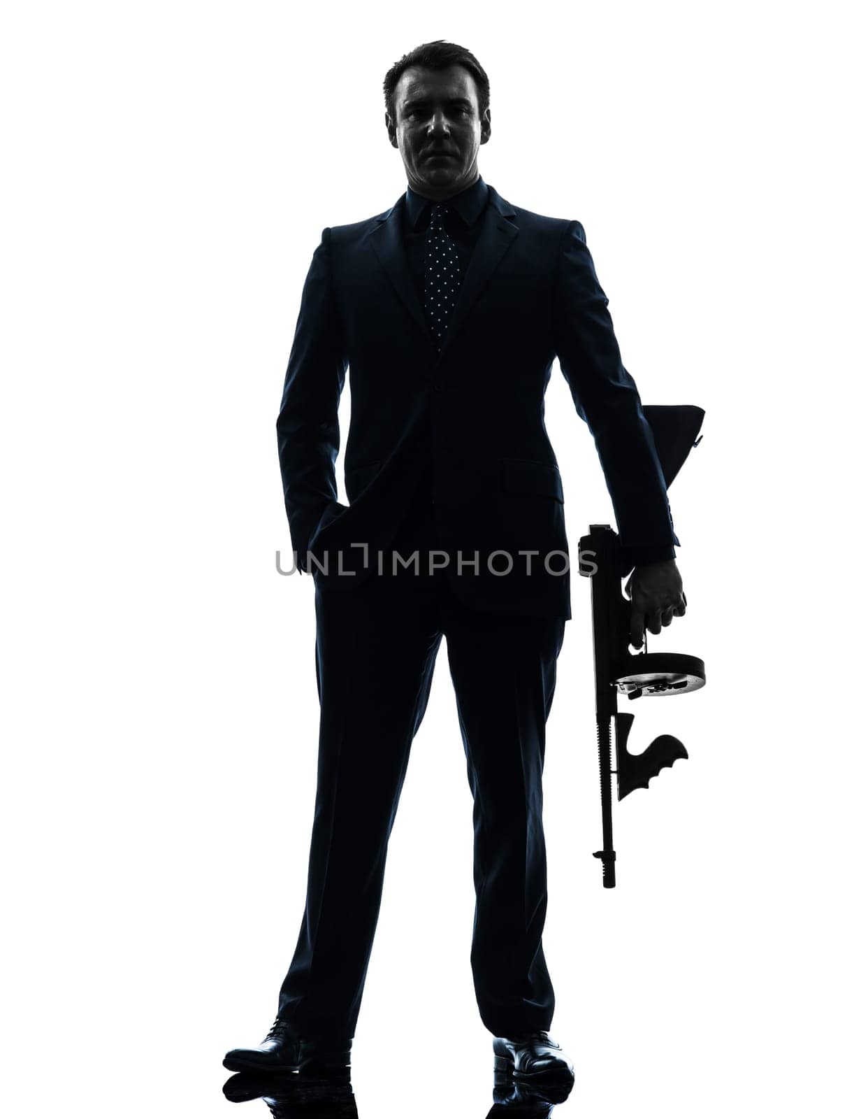 one caucasian man holding thompson machine gun  in silhouette on white background