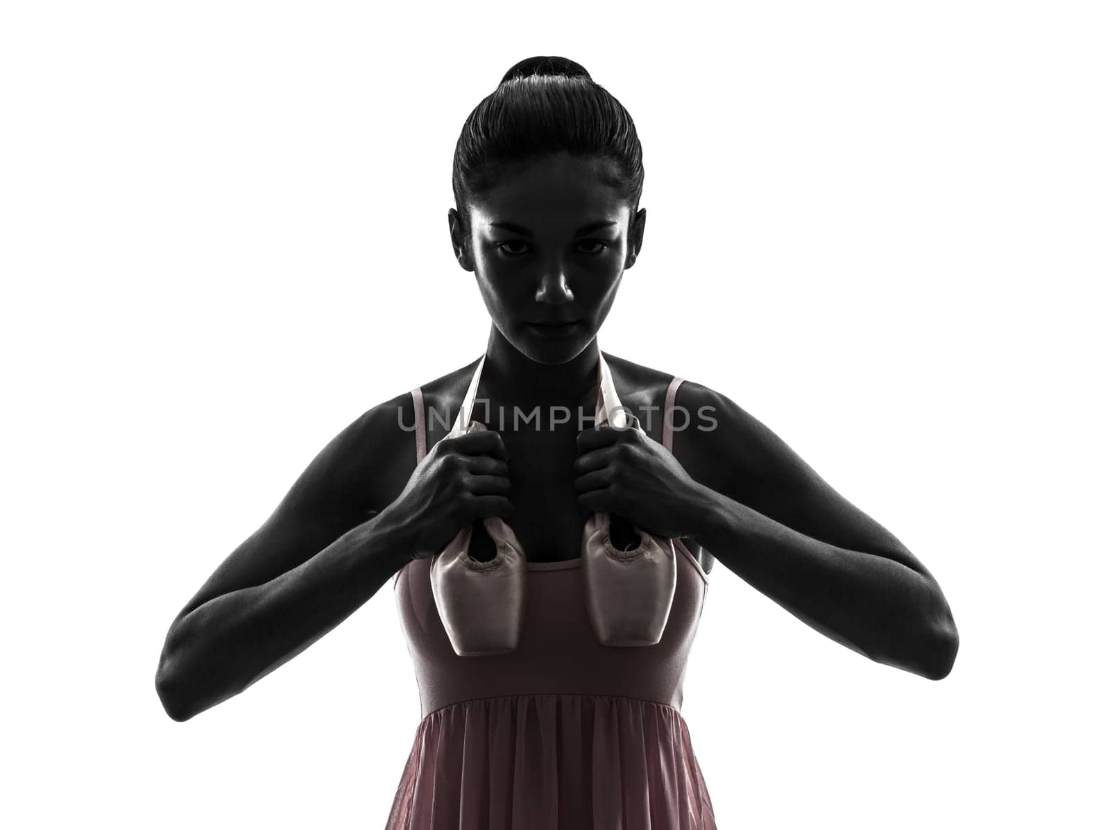 one woman ballerina ballet dancer dancing holding shoes in silhouette on white background