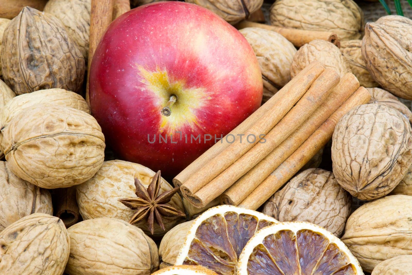walnuts, cinnamon sticks, apple
