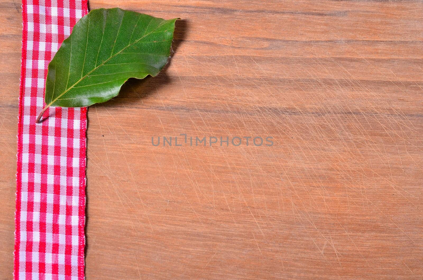 old wood background with red ribbon