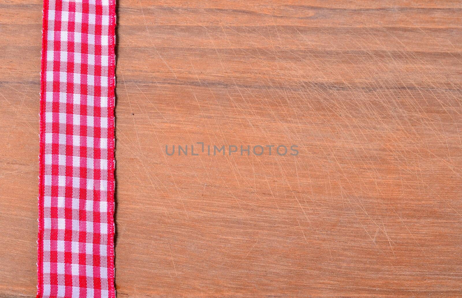 old wood background with red ribbon