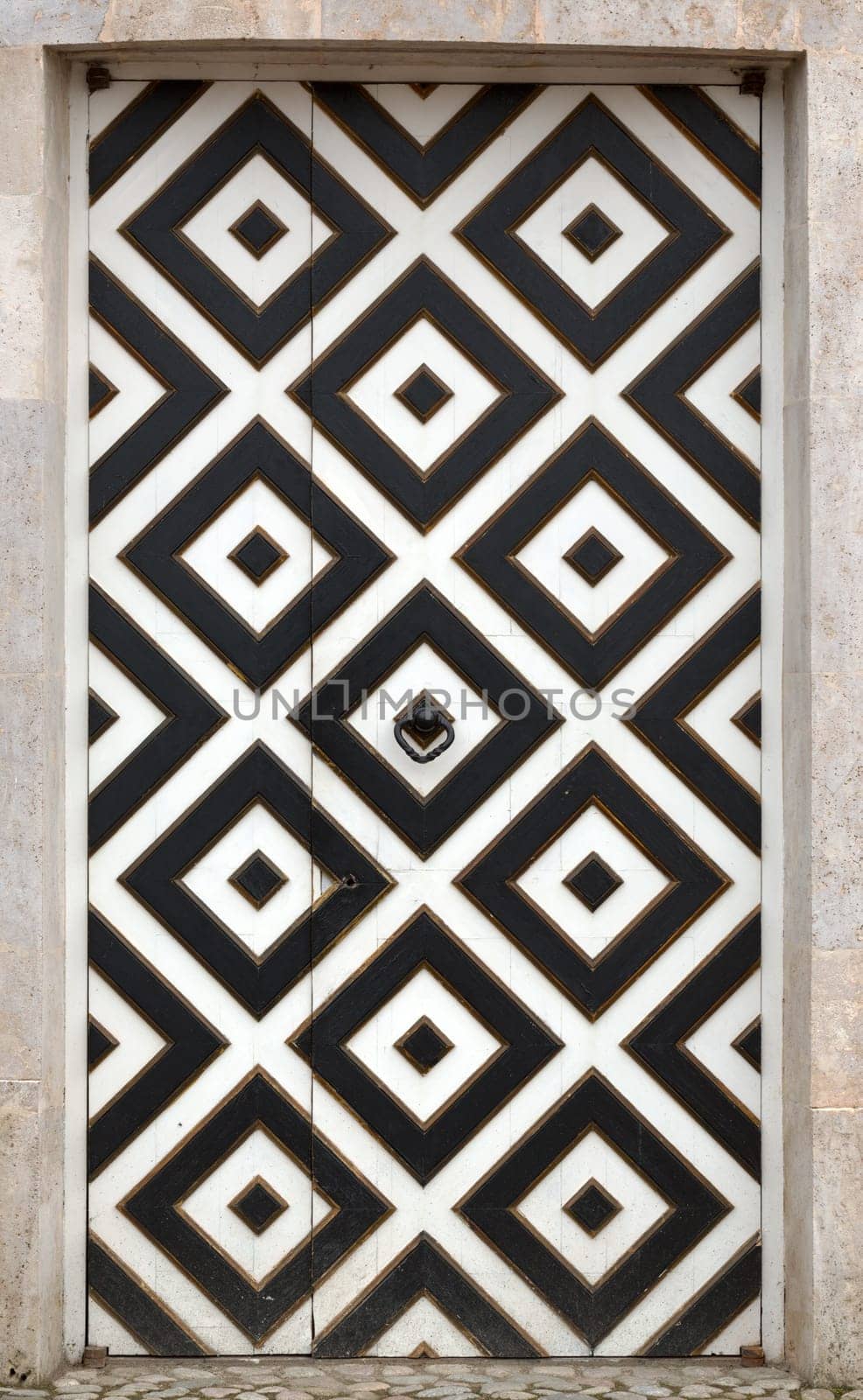 old doors of the fortress with a geometric pattern