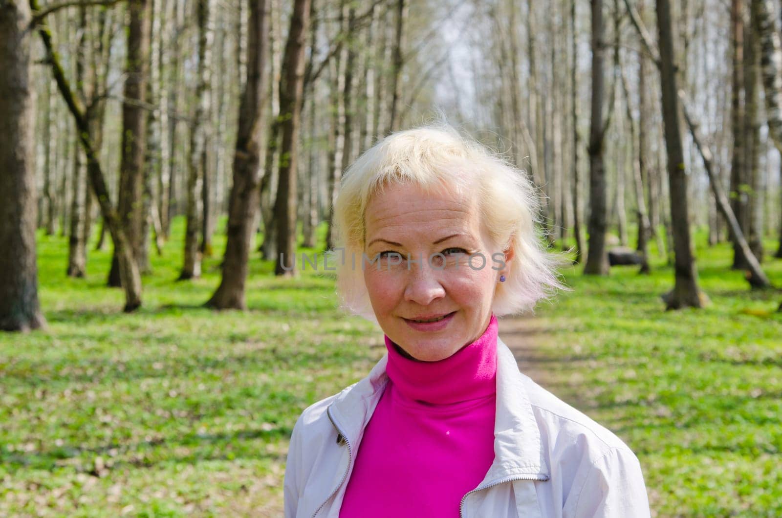 Portrait of a middle-aged woman in a spring Park