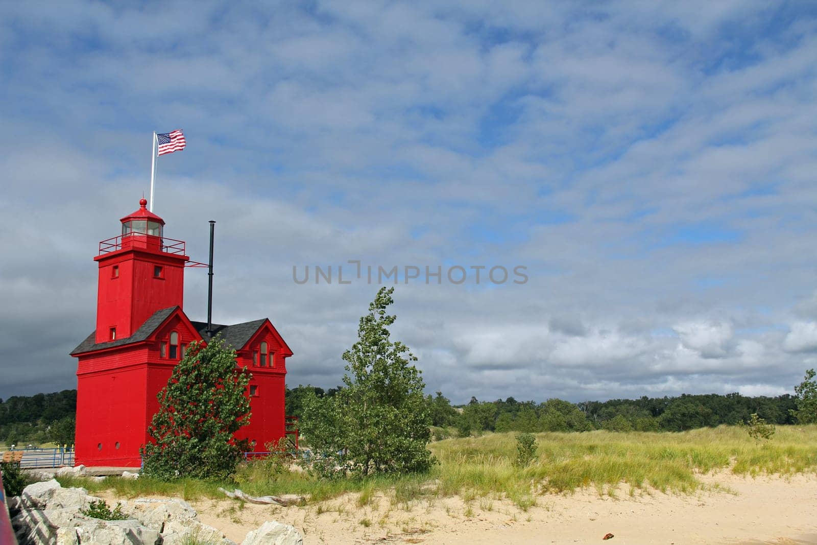 Big Red Lighthouse on the beach in Holland Michigan with copy space.