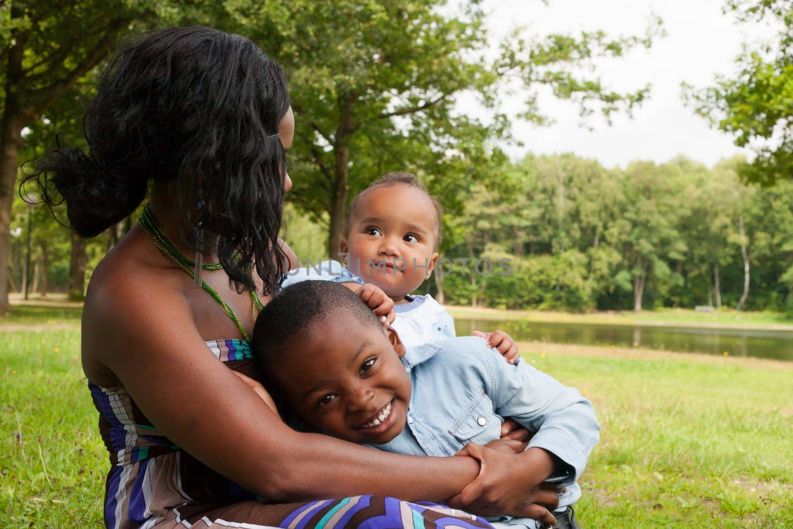 Happy mixed family is having a nice day in the park