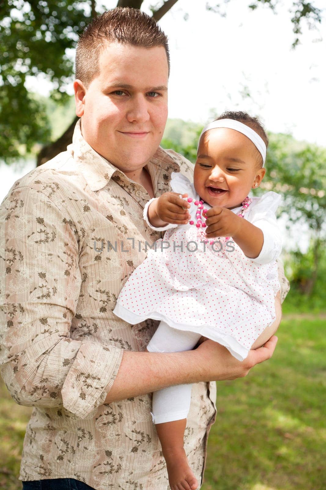 Happy mixed family is having a nice day in the park