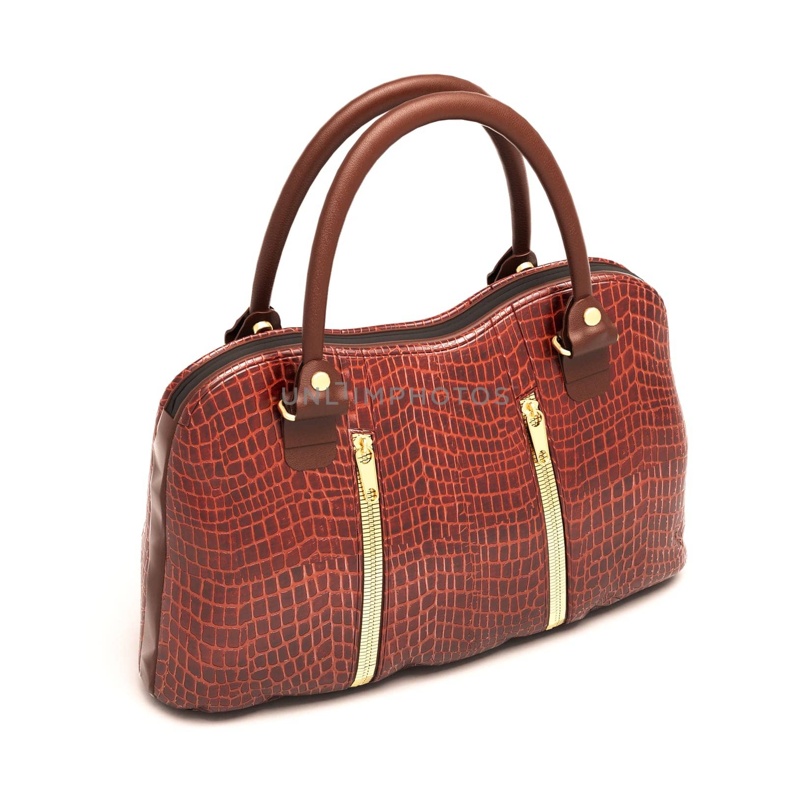 Crocodile leather women's handbag isolated on white background