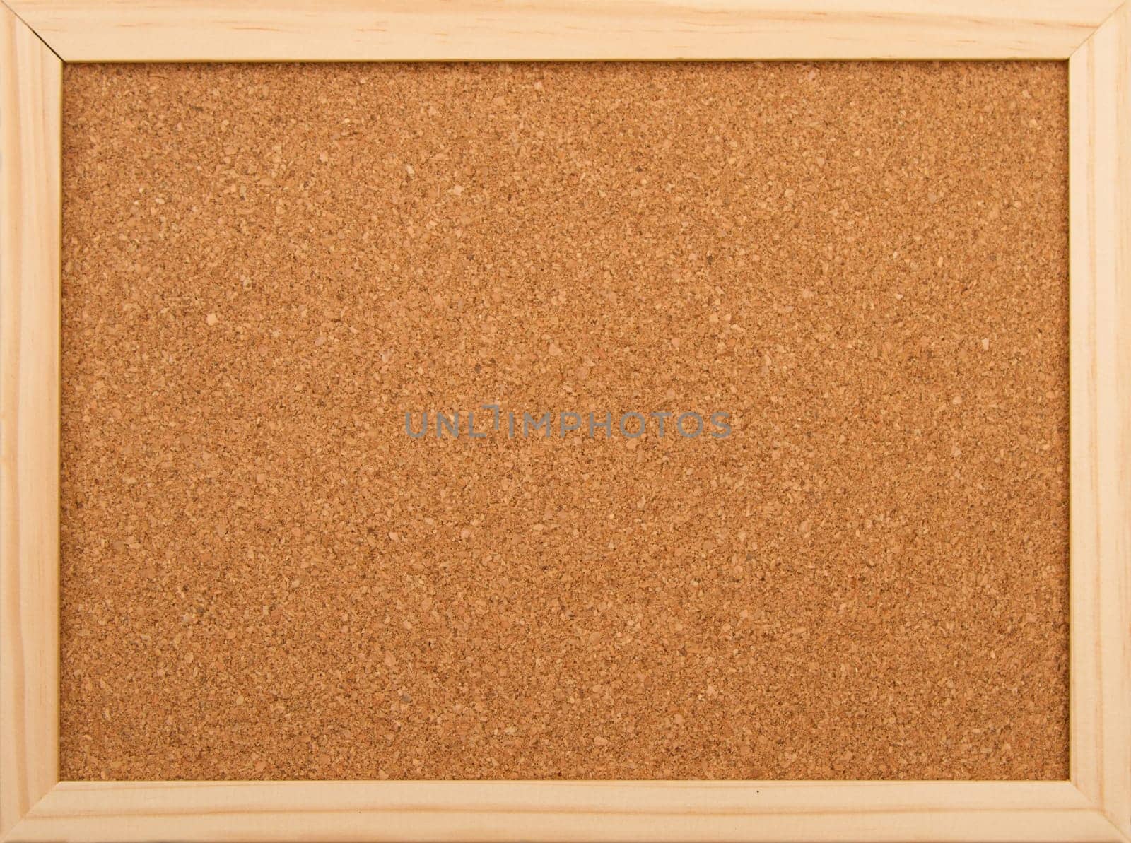Cork board with a wooden frame..