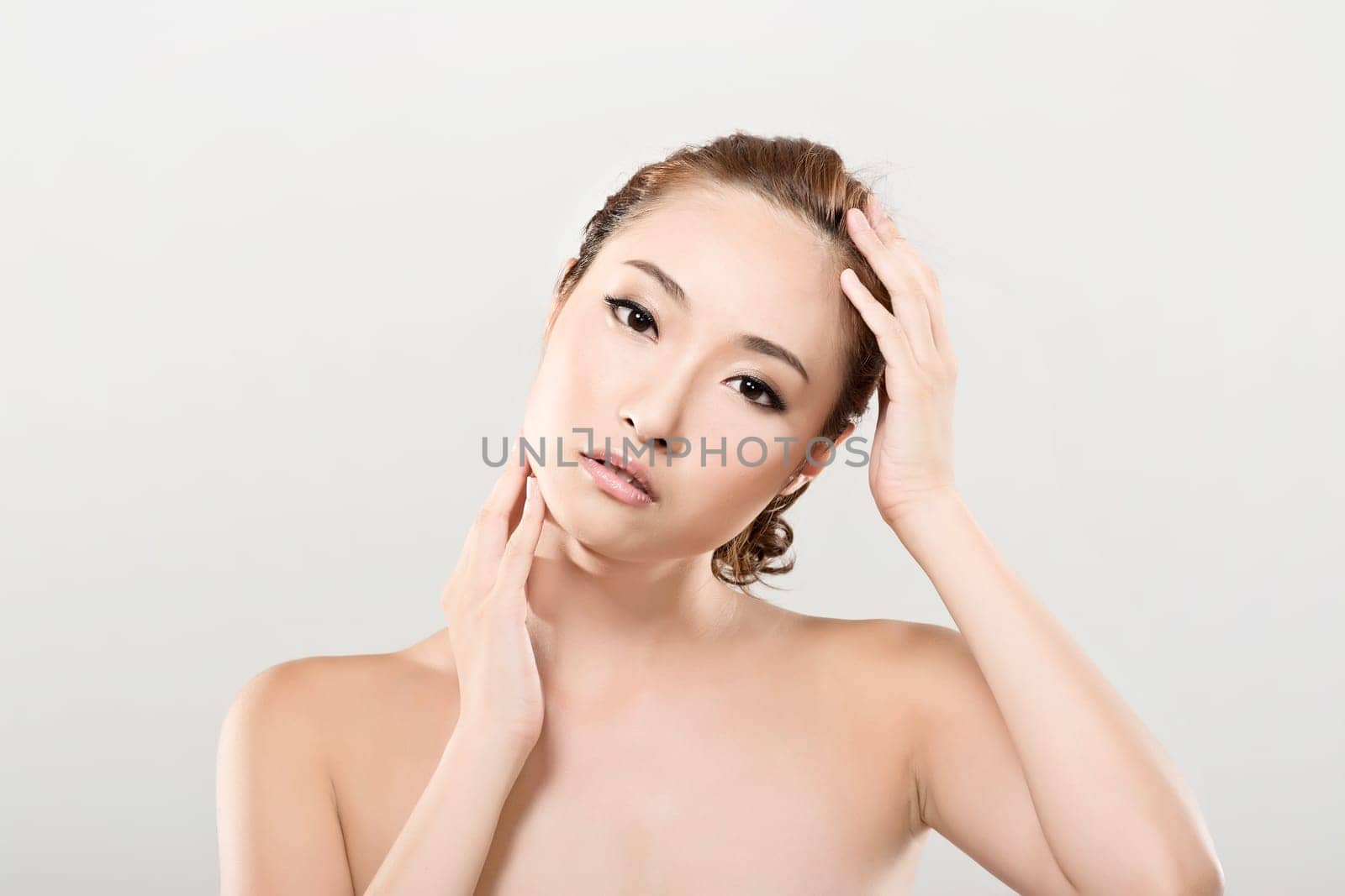 Asian beauty face closeup portrait with clean and fresh elegant lady. Studio shot.