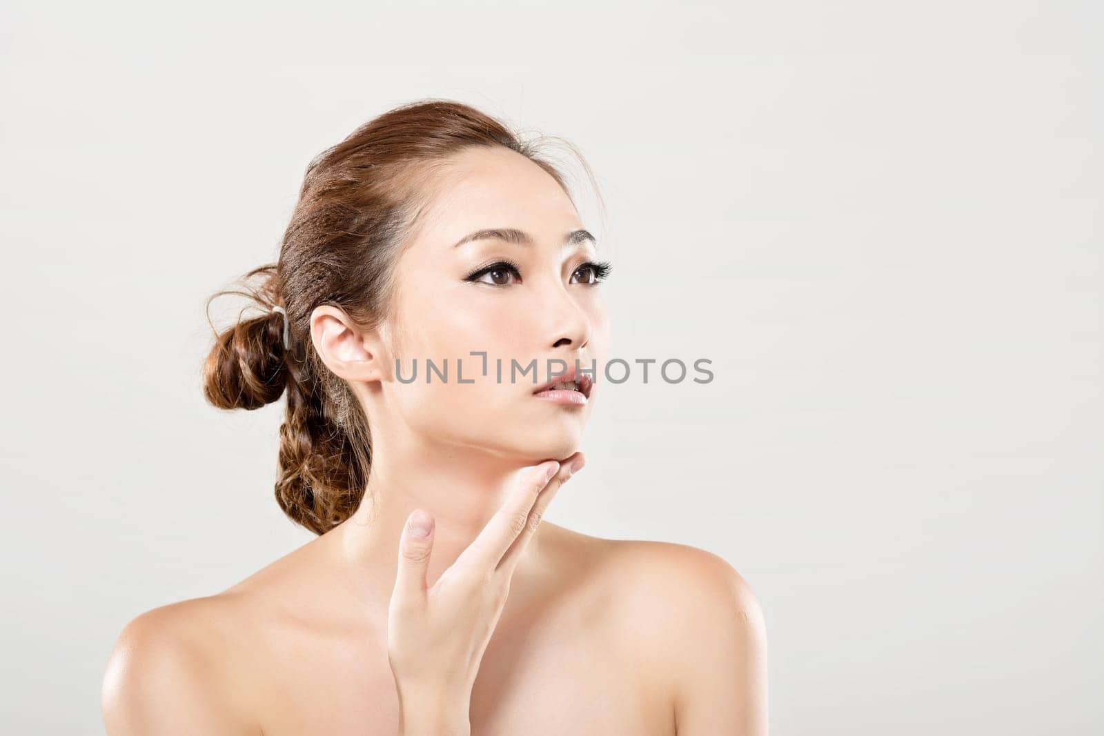 Asian beauty face closeup portrait with clean and fresh elegant lady. Studio shot.