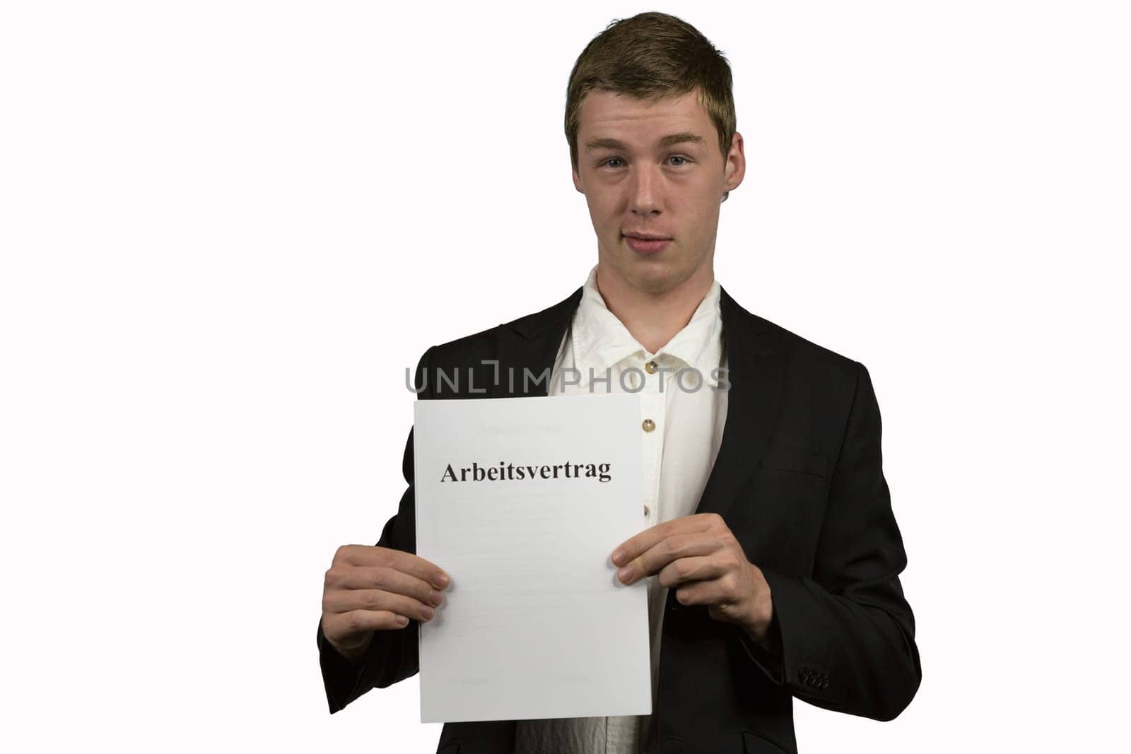Young man holds an employment contract in his hands and is happy