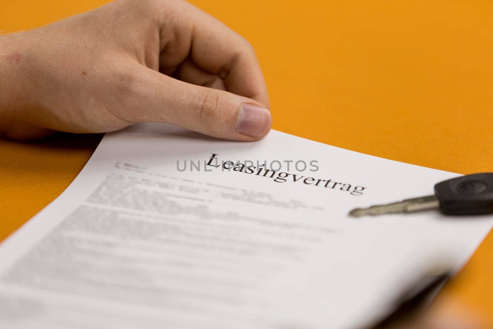 Leasing contract with car key is signed