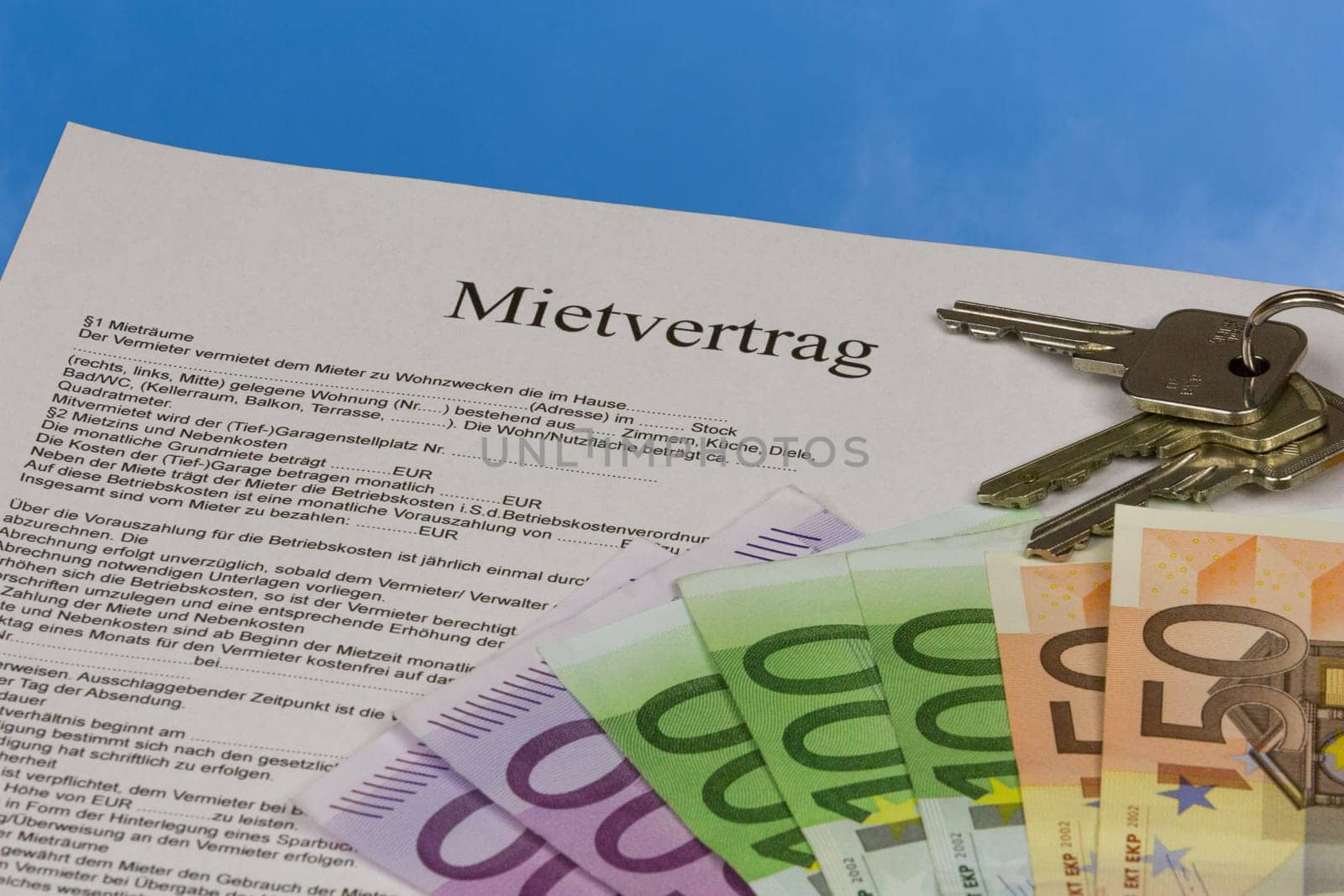 Rental agreement with house keys and banknotes
