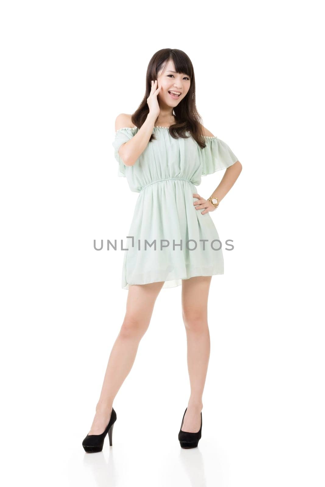 Asian beautiful elegant woman, stretched arms. Full length portrait. Isolated on the white background.