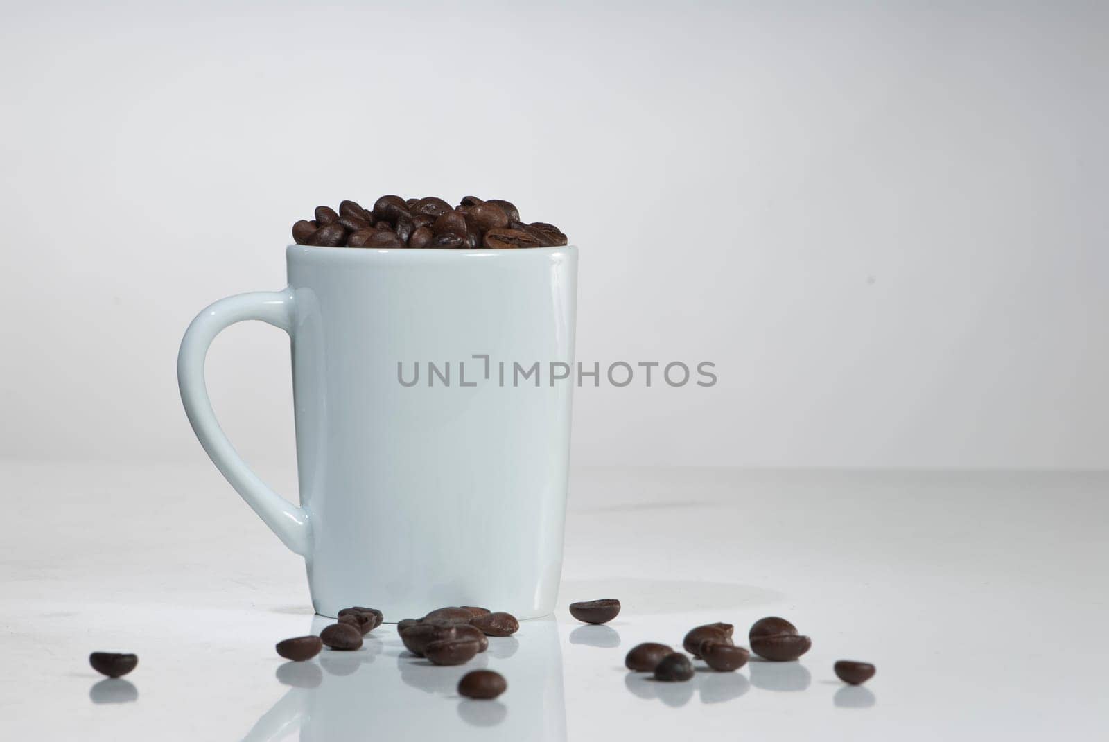 Cup with coffee beans