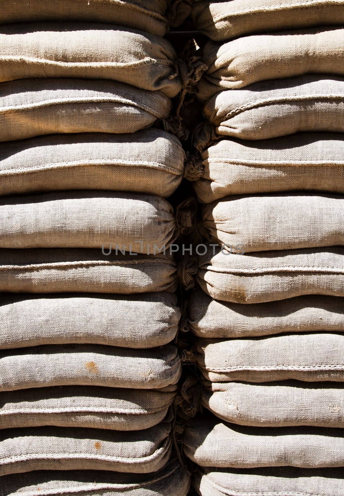 A wall of sandbags protecting checkpoint Charlie in Berlin .