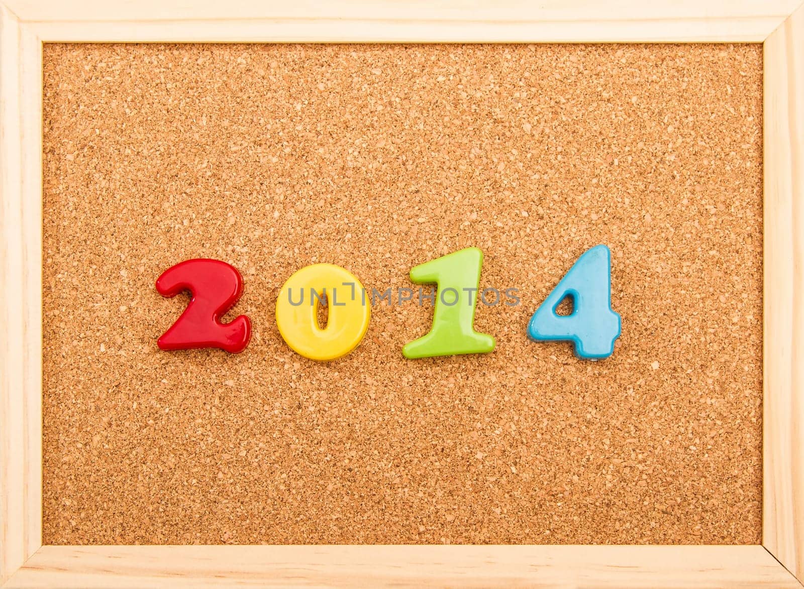 New year, 2014, written on a cork board.