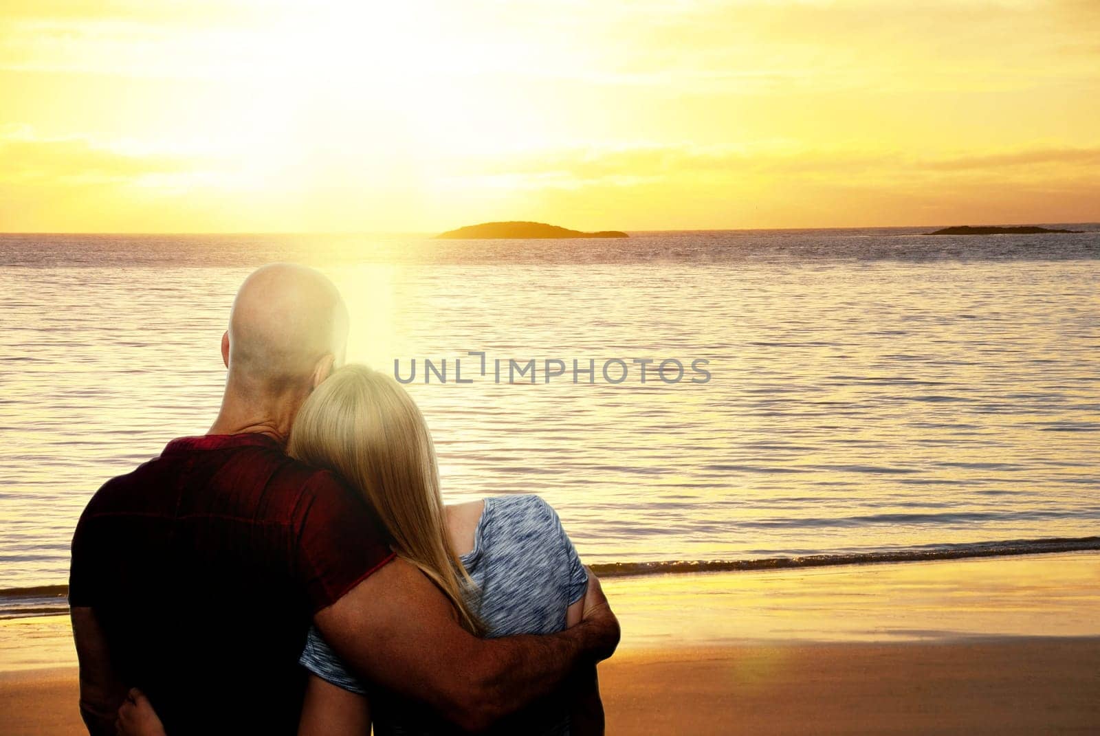 A Golden Warm Sunset at the Sea With Sandy Beach