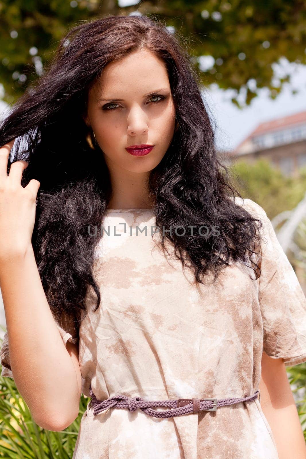 Beautiful sensual young woman in summer outdoors hair makeup fashion lifestyle