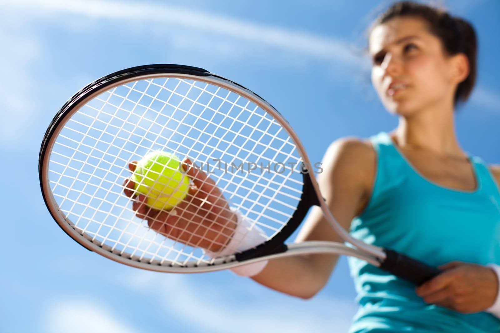 Young woman tennis player on the court
