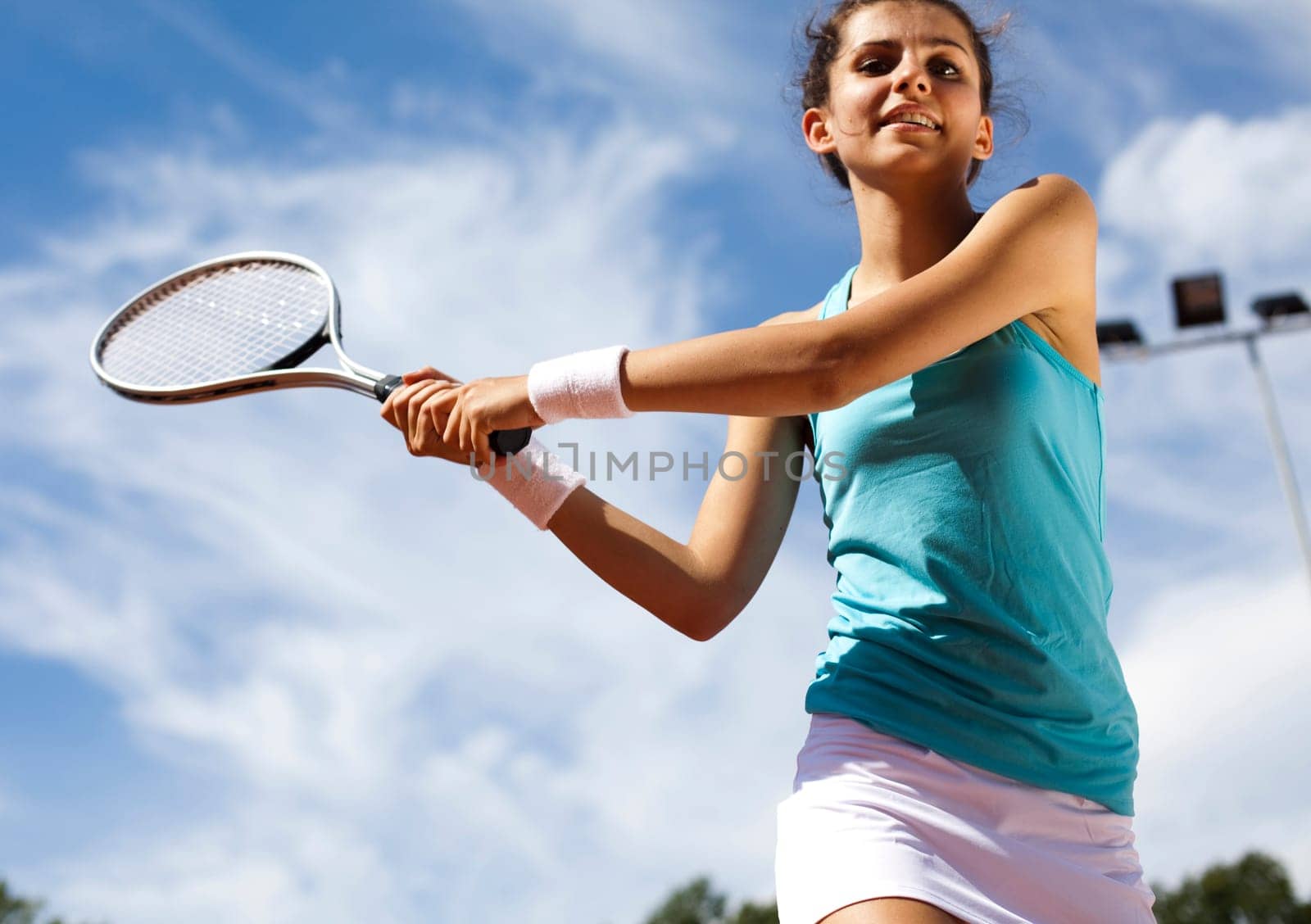 Young woman playing tennis