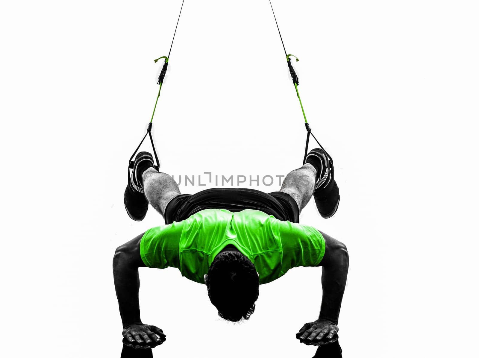 one caucasian man exercising   suspension training  trx   on white background