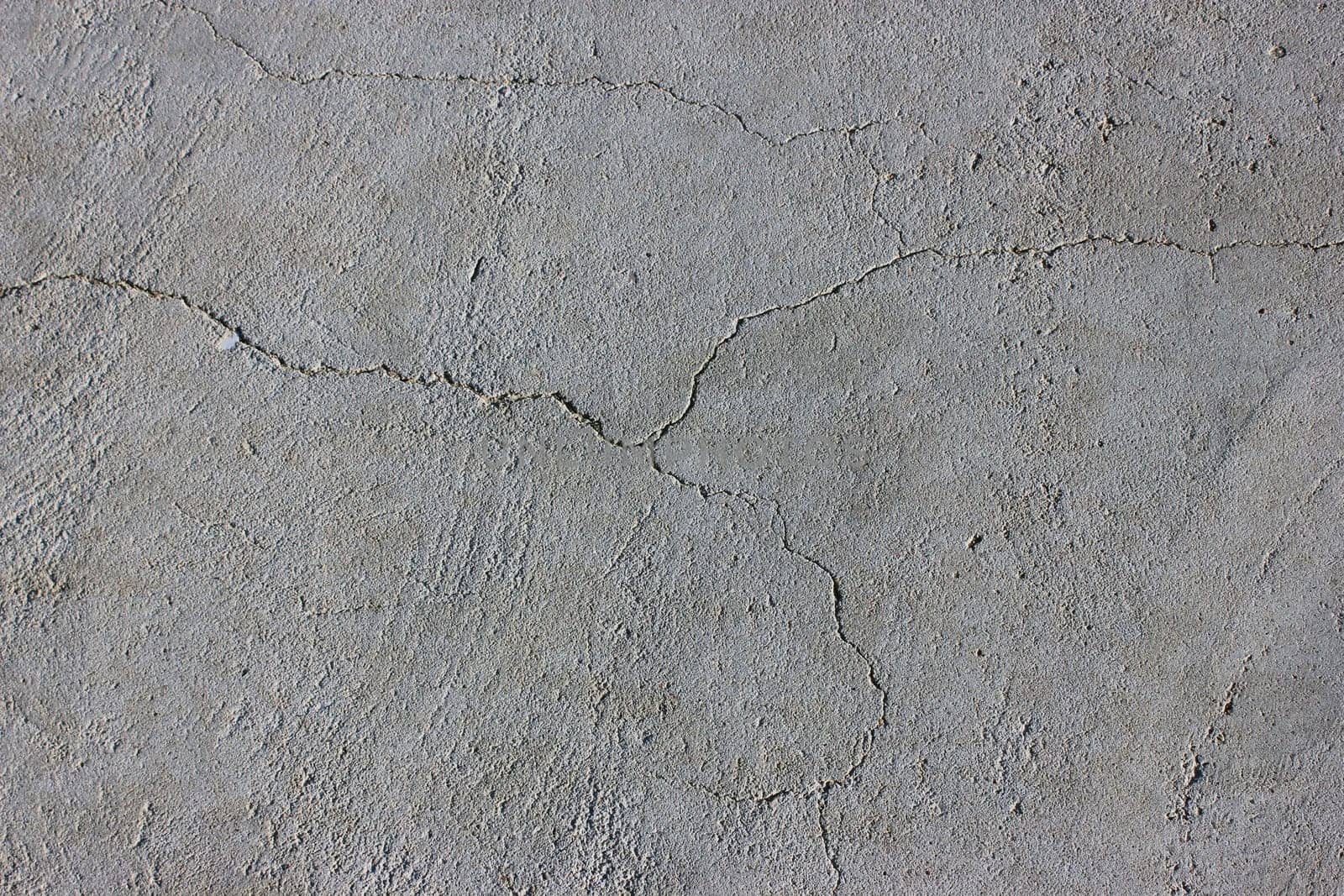Grunge concrete cement wall with crack in industrial building
