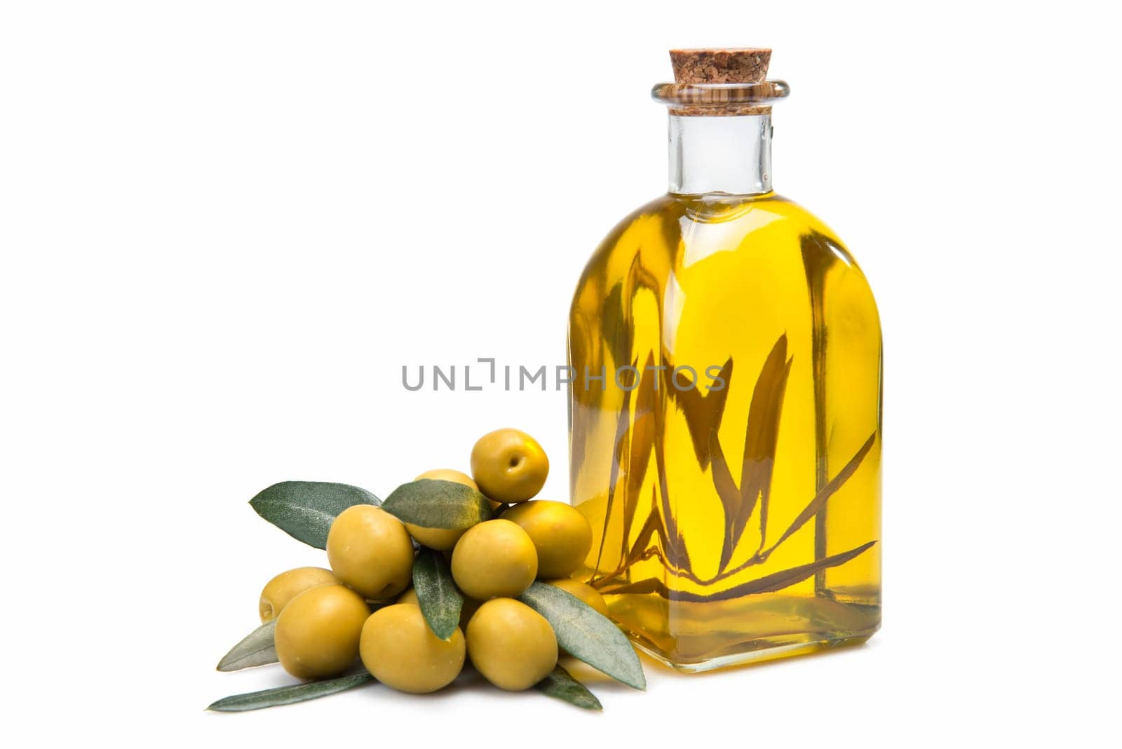 A jar with olive oil and some green olives isolated over a white background.
