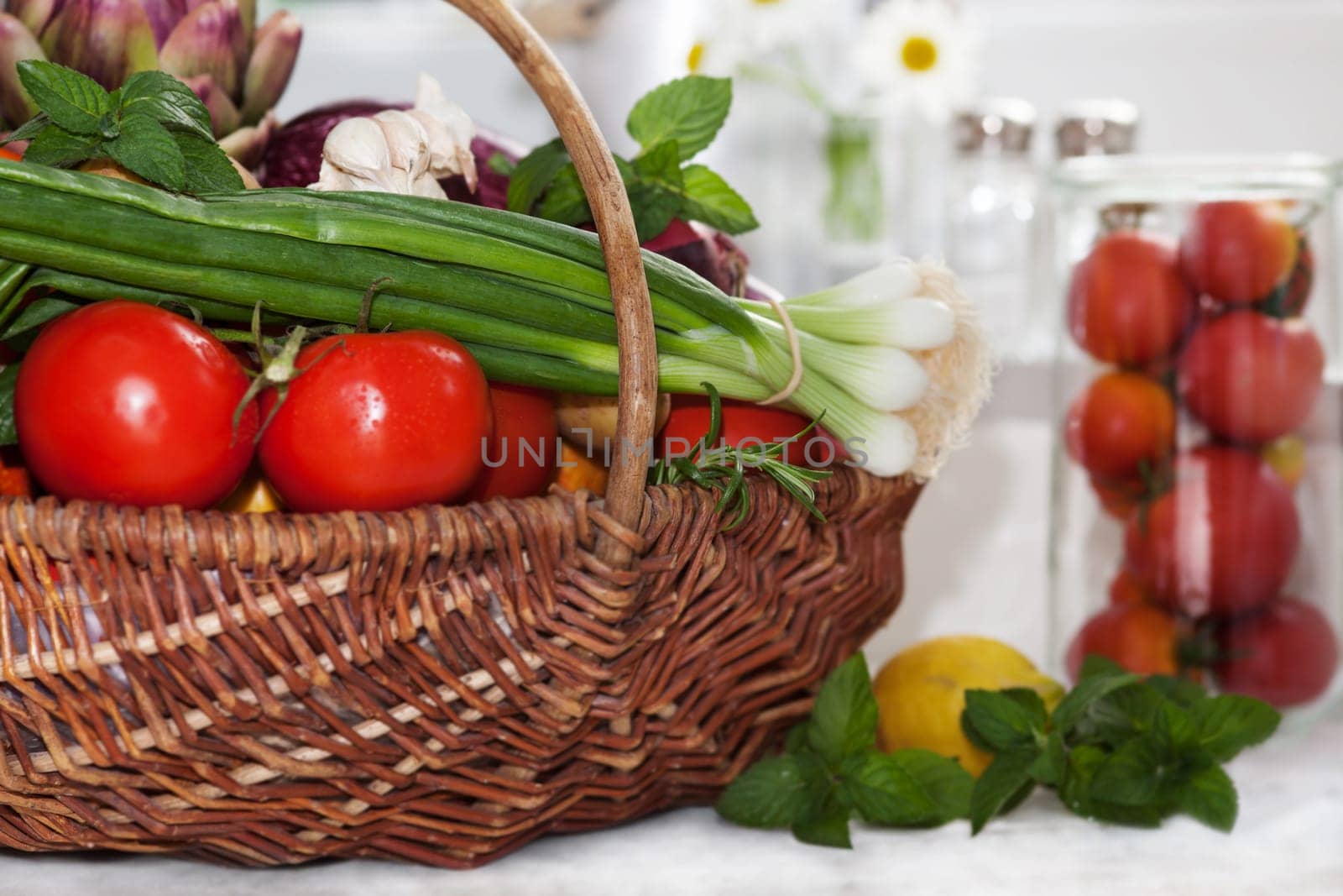 Vegetables in the basket isolated to white