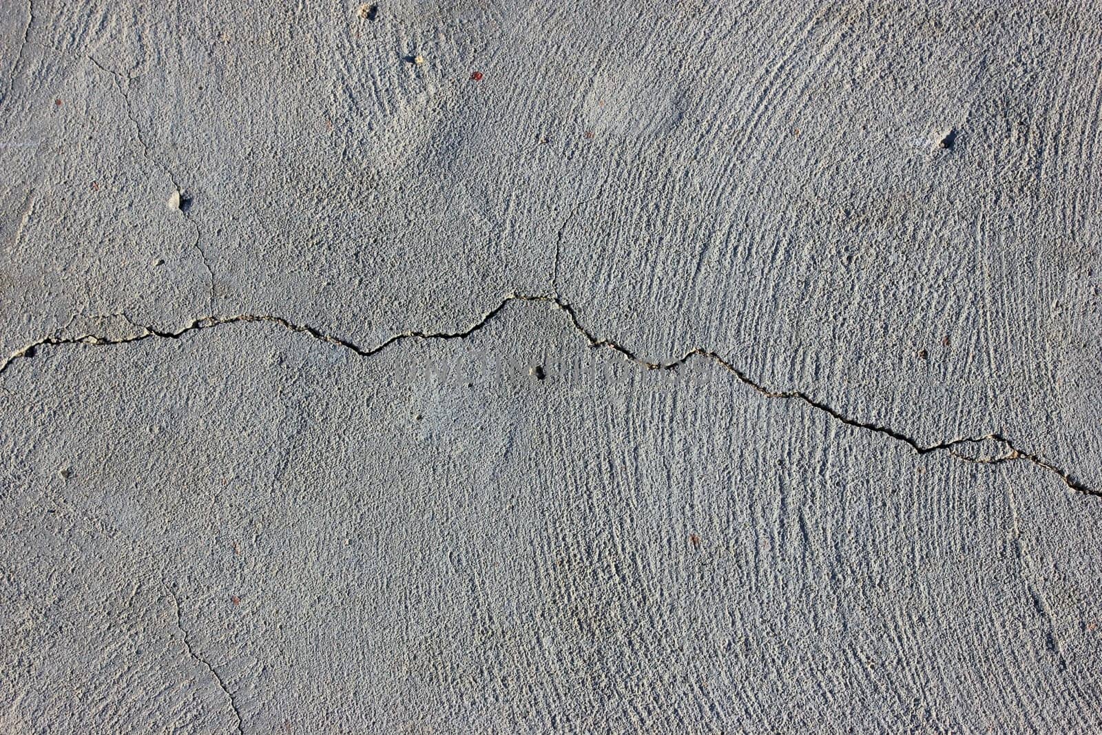 Grunge concrete cement wall with crack in industrial building
