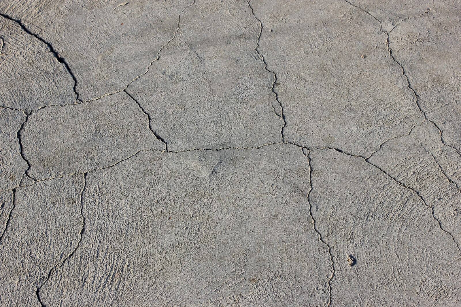 Grunge concrete cement wall with crack in industrial building
