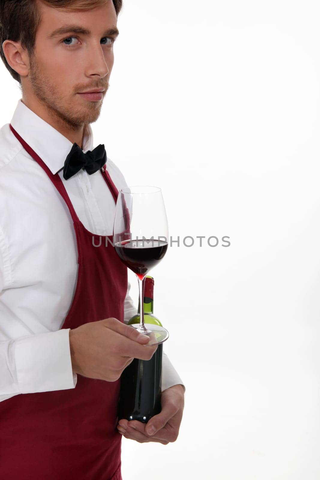 Sommelier serving a bottle of wine