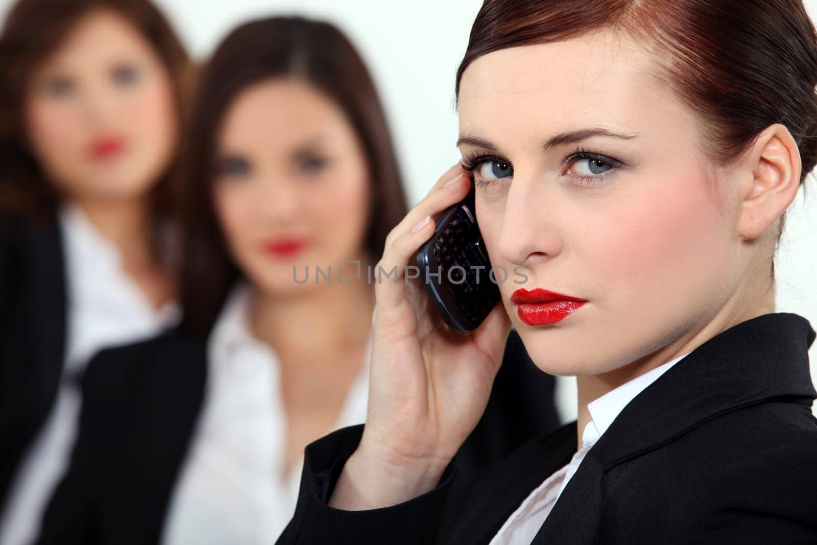 Pretentious woman talking on her mobile phone