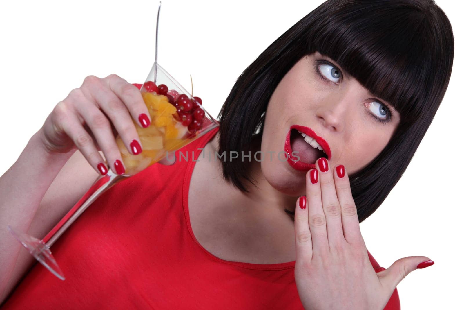 Woman eating fruit salad