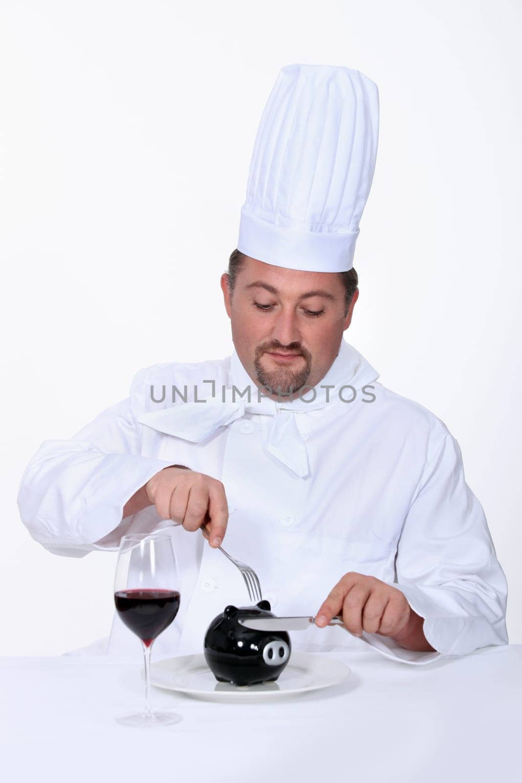 Chef cutting into his savings