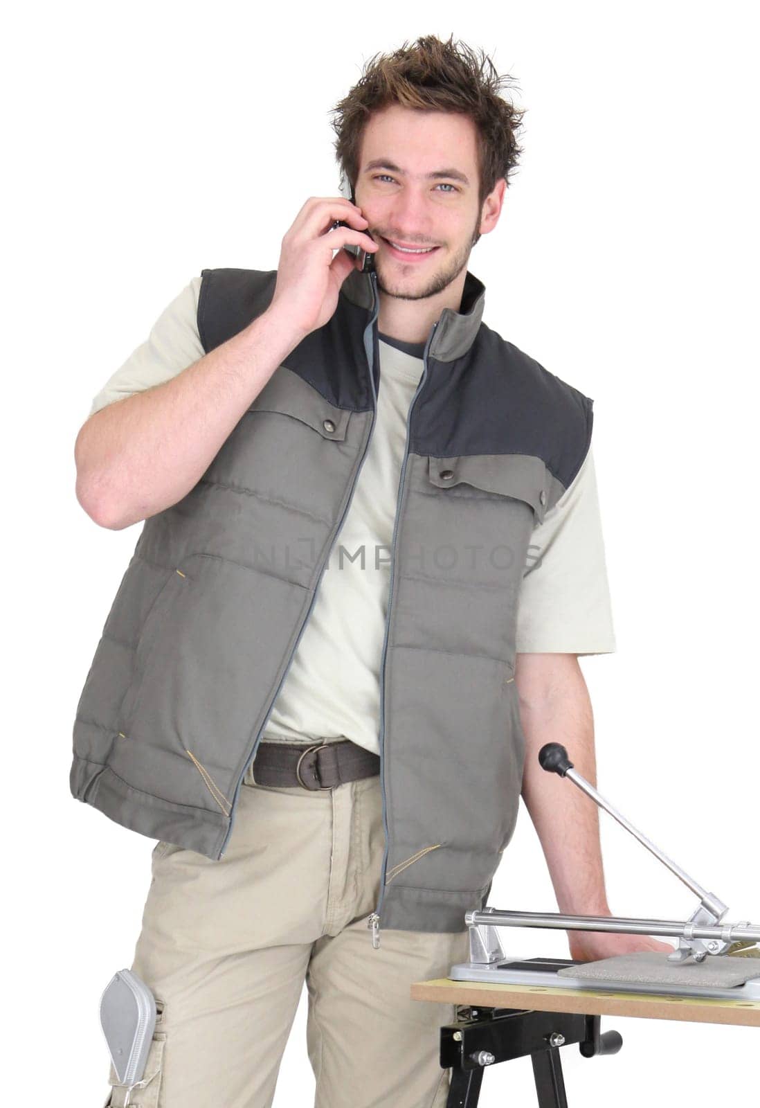 Tile fitter posing with his building materials