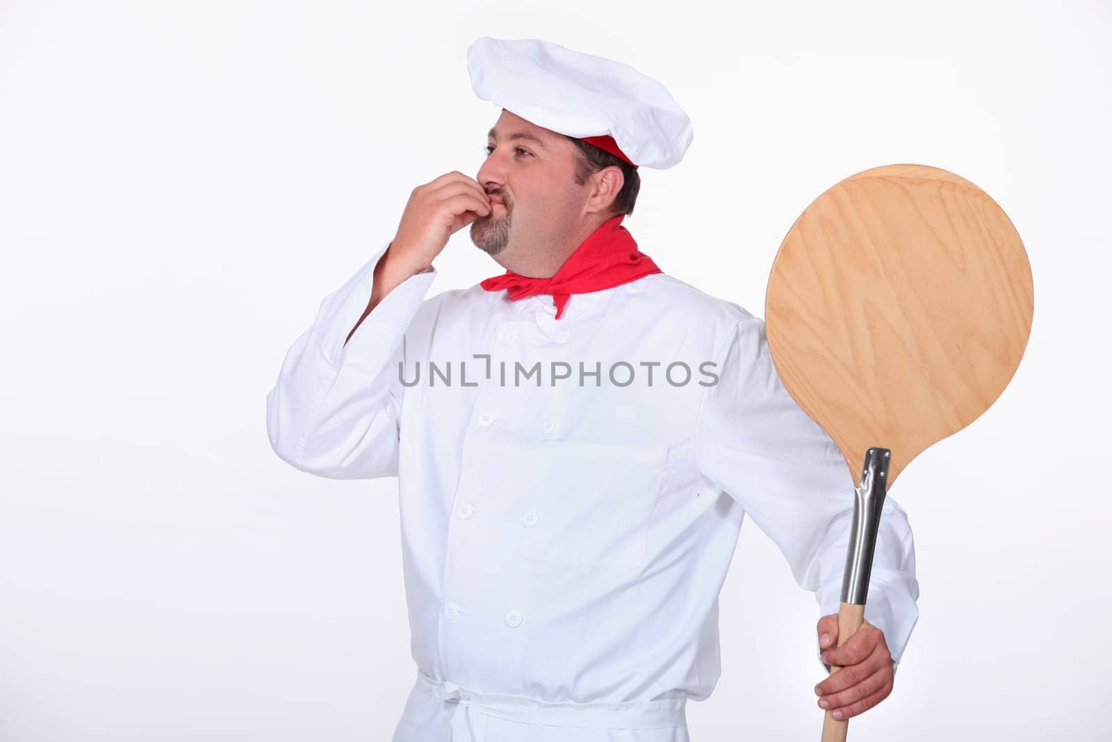 Pizza chef with a wooden peel