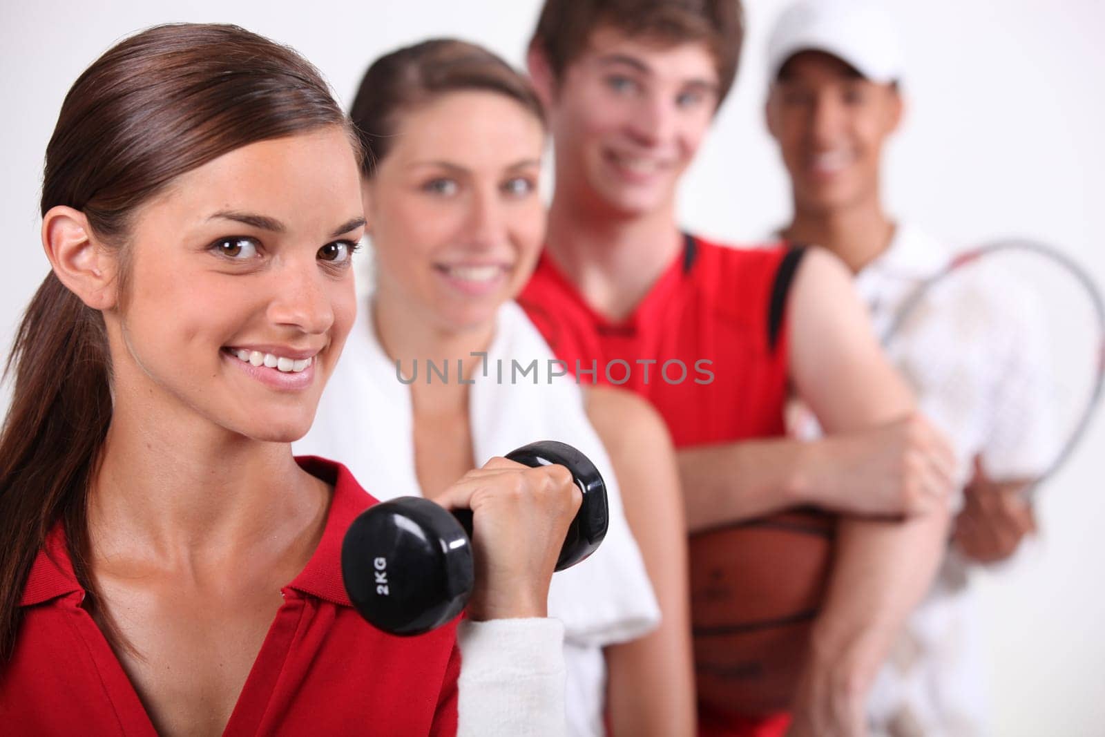 Teenagers dressed for variety of sports