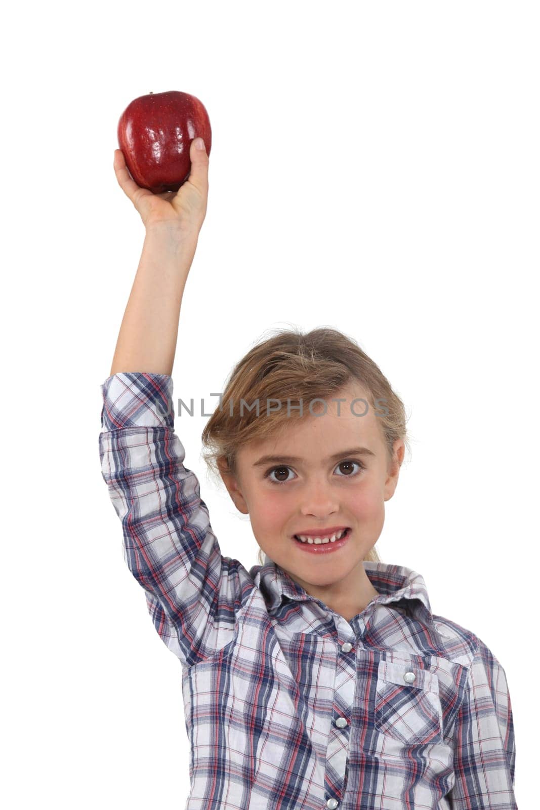 Studio portrait of a little girl with an apple