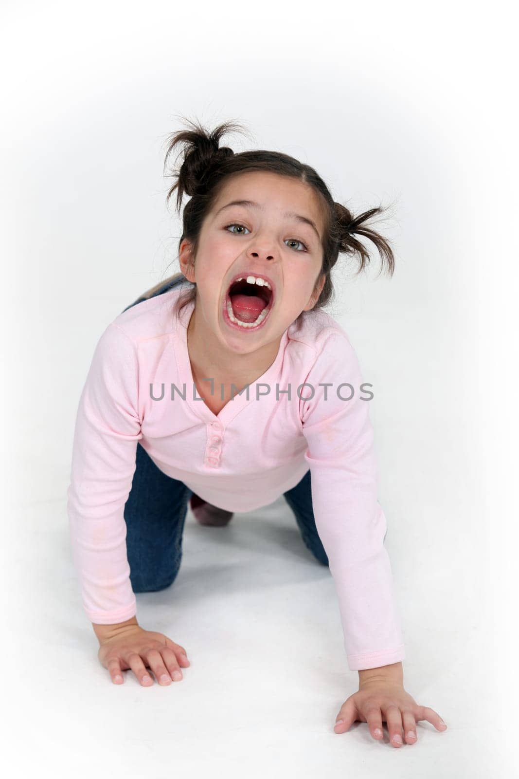 child girl on all fours is screaming