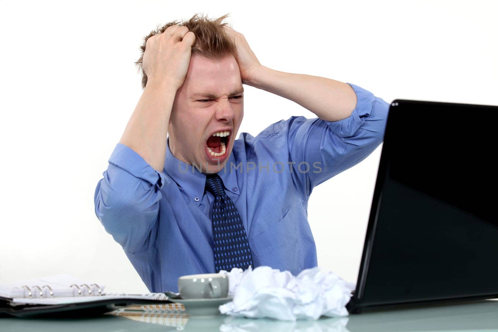 Frustrated man pulling his hair out