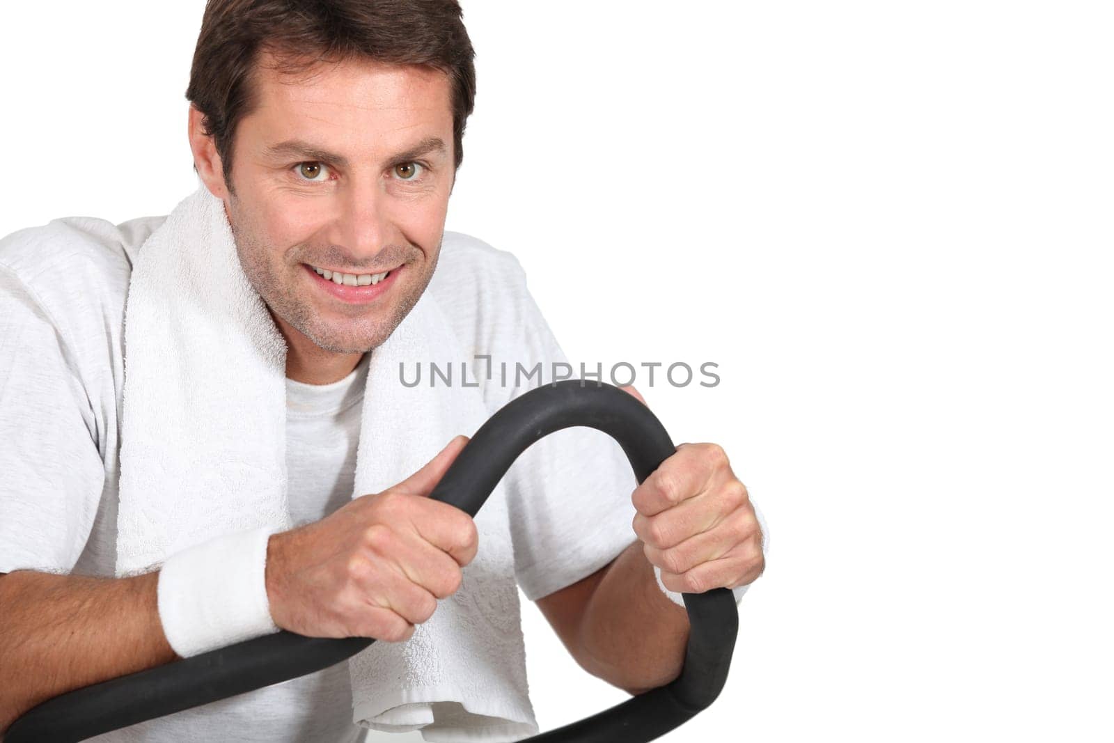 Man using a running machine in a gym