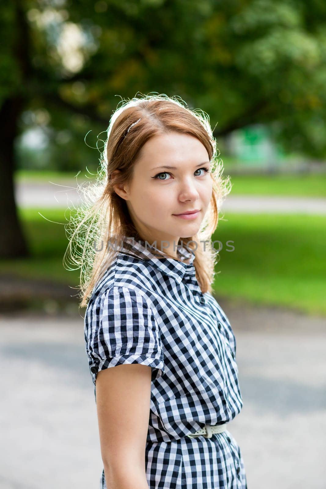 Nice portrait of woman in blue checkered dress