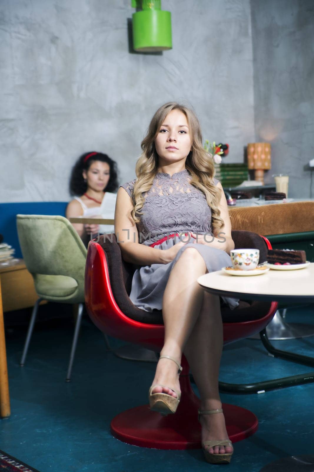 Woman rest at soft chair with demanding look