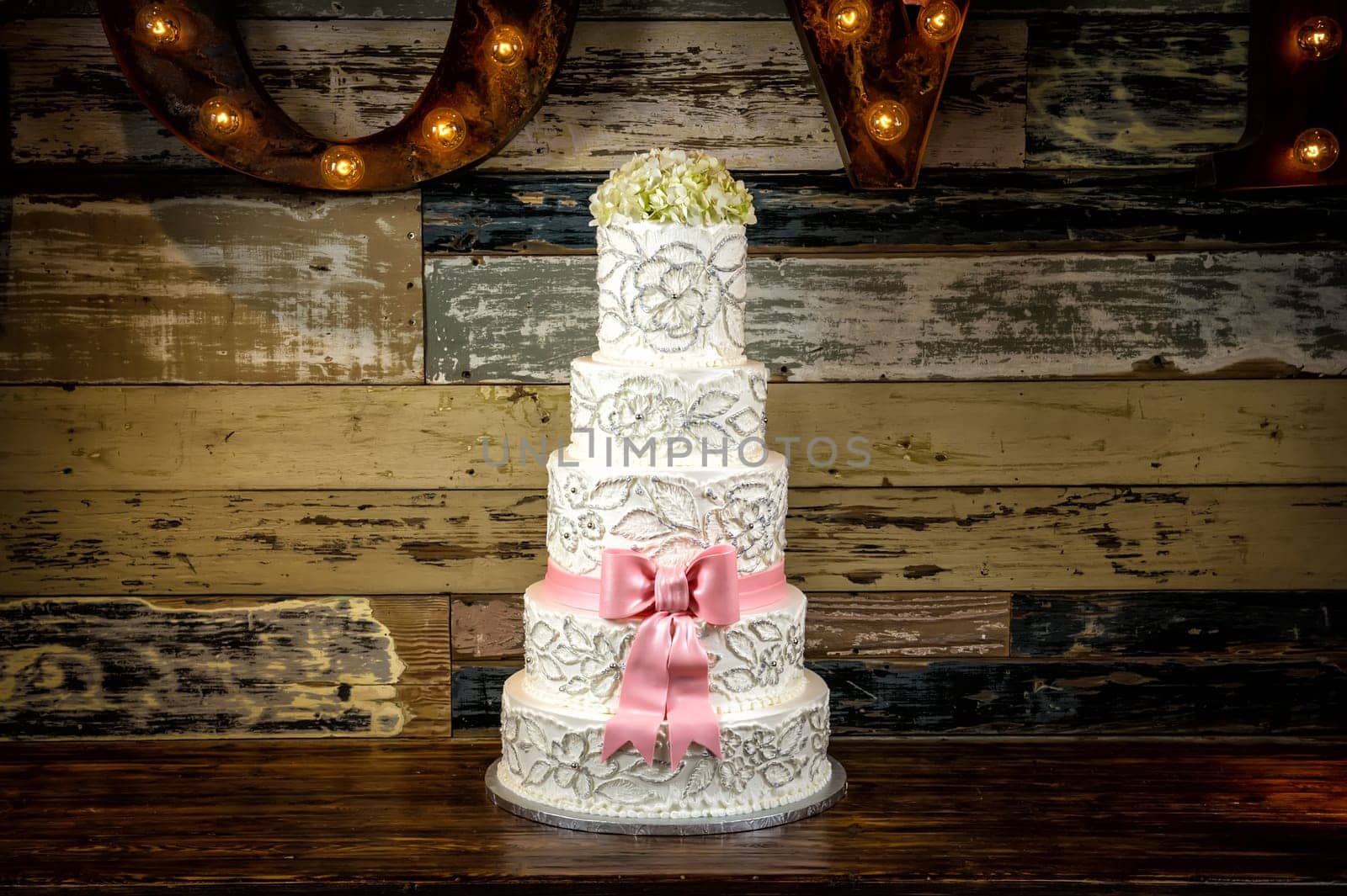 Image of a beautiful wedding cake with a rustic background