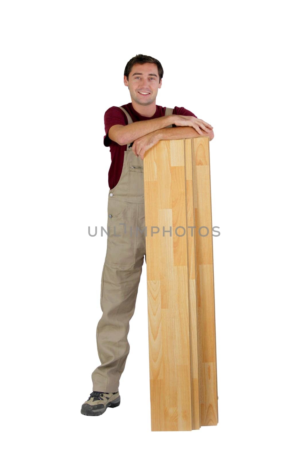 Worker with wooden floorboards