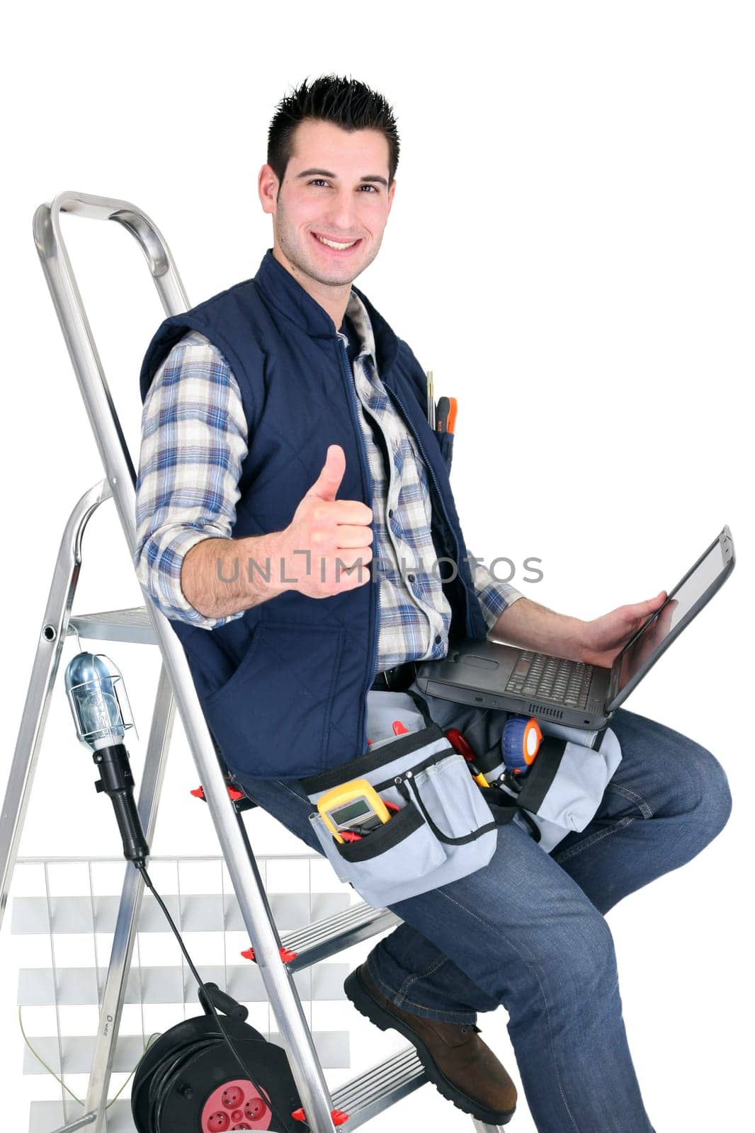 handyman with tools and a computer