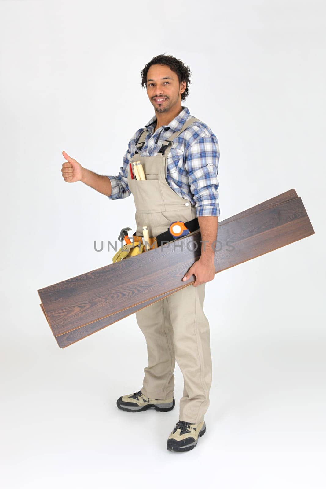 Man with laminate flooring giving thumbs-up