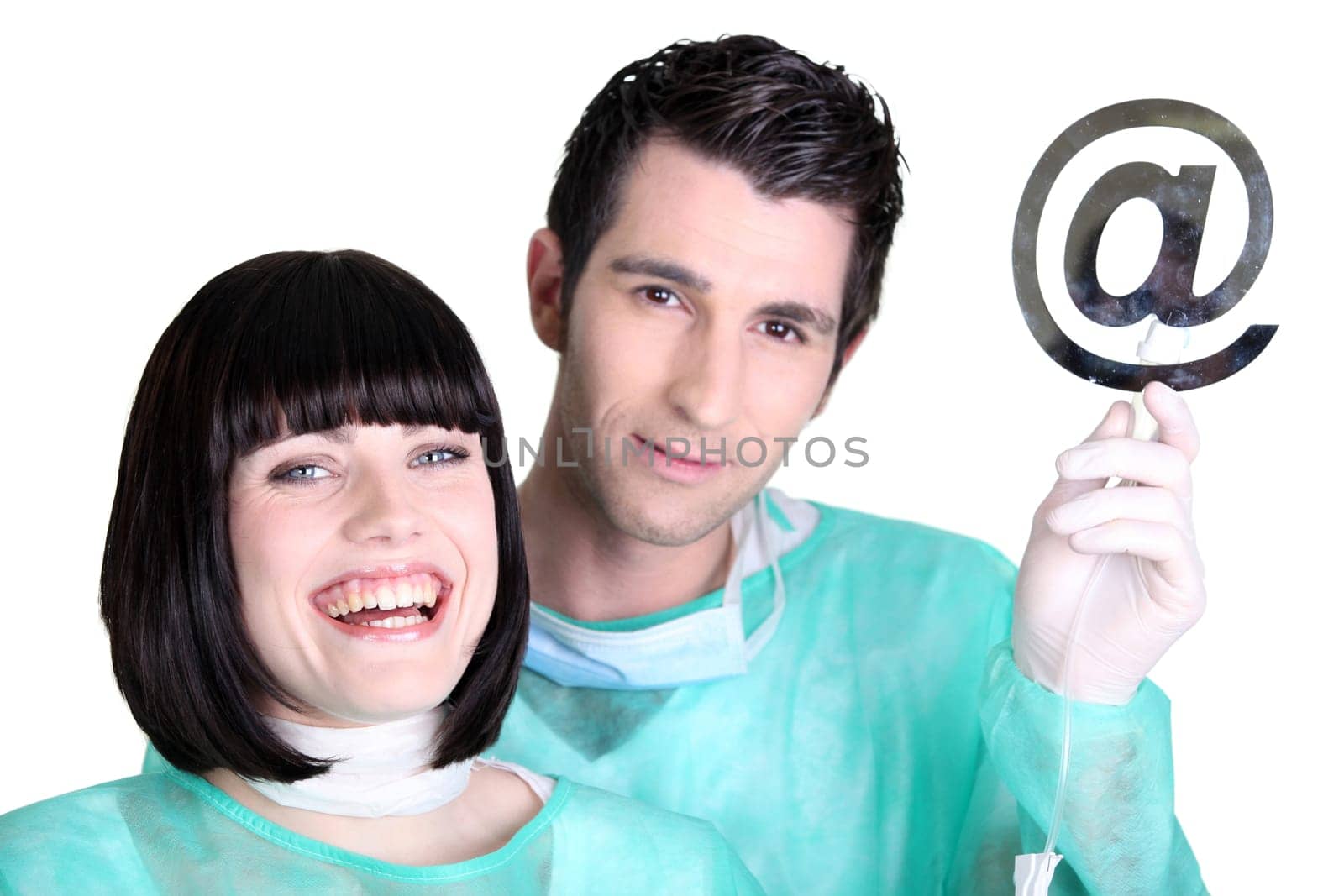 Doctors holding up the at symbol