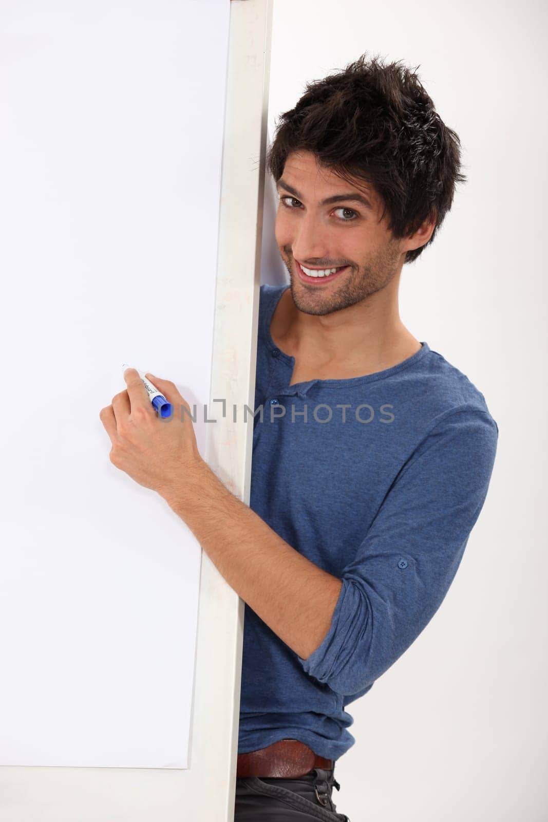 Man about to write on a blank presentation board